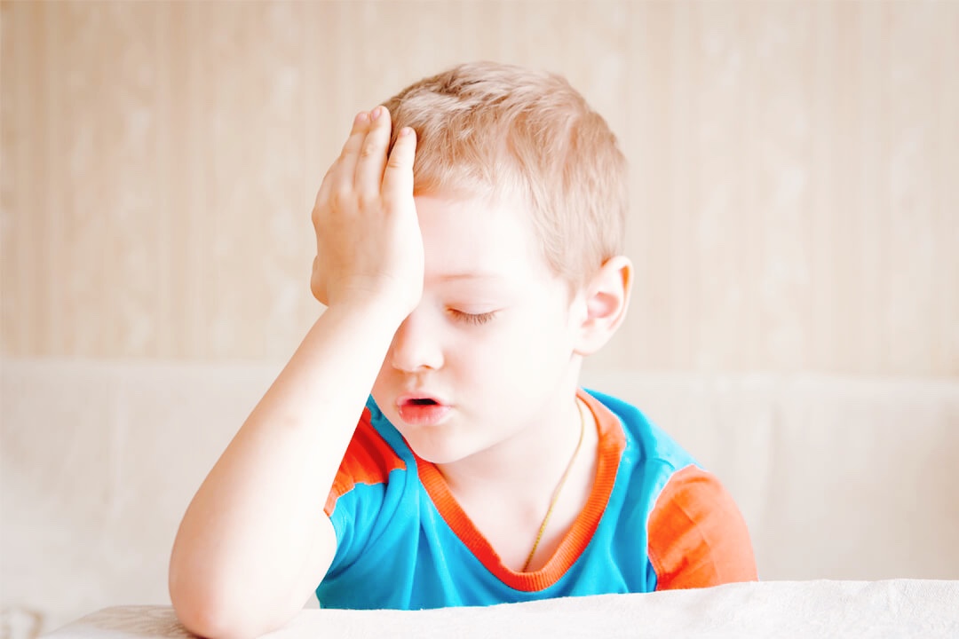 Child experiencing headaches